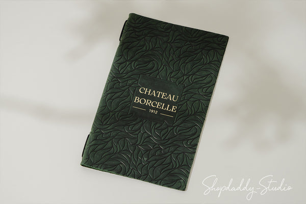Green Leather Menu Cover with Leaf Pattern in details