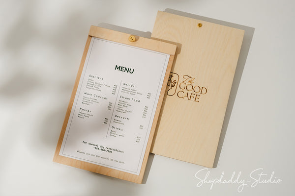 Light-colored plywood menu board with a minimalist design and brass screw accent
