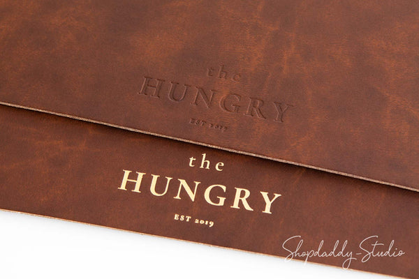 Minimalist recycled leather placemat with antique brown texture, perfect for dining tables.