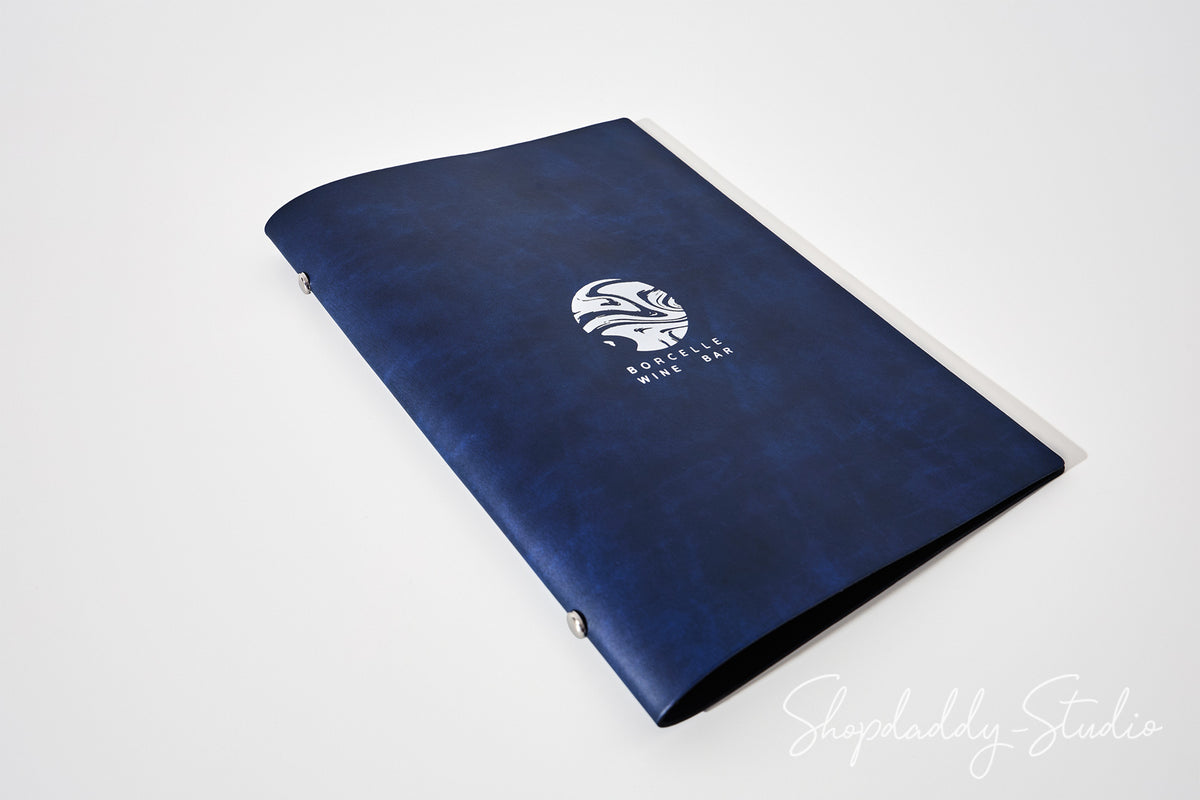 A dark navy blue book-style folder or menu cover with a white circular logo and the text 'BUTTERFLY WINE & CIDER' printed on the front, photographed on a clean white background.