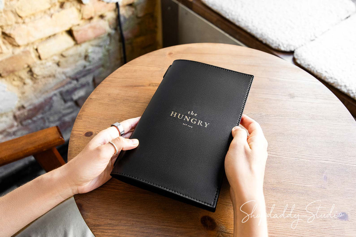 Black Menu Cover with Stitching and Elastic Band and gold logo