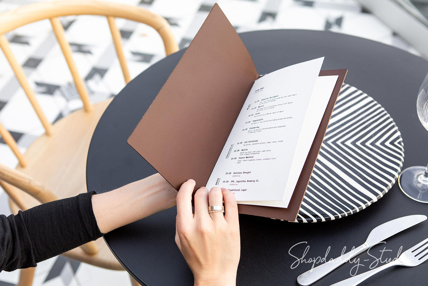 Close-up of recycled leather menu cover showcasing its antique brown texture.