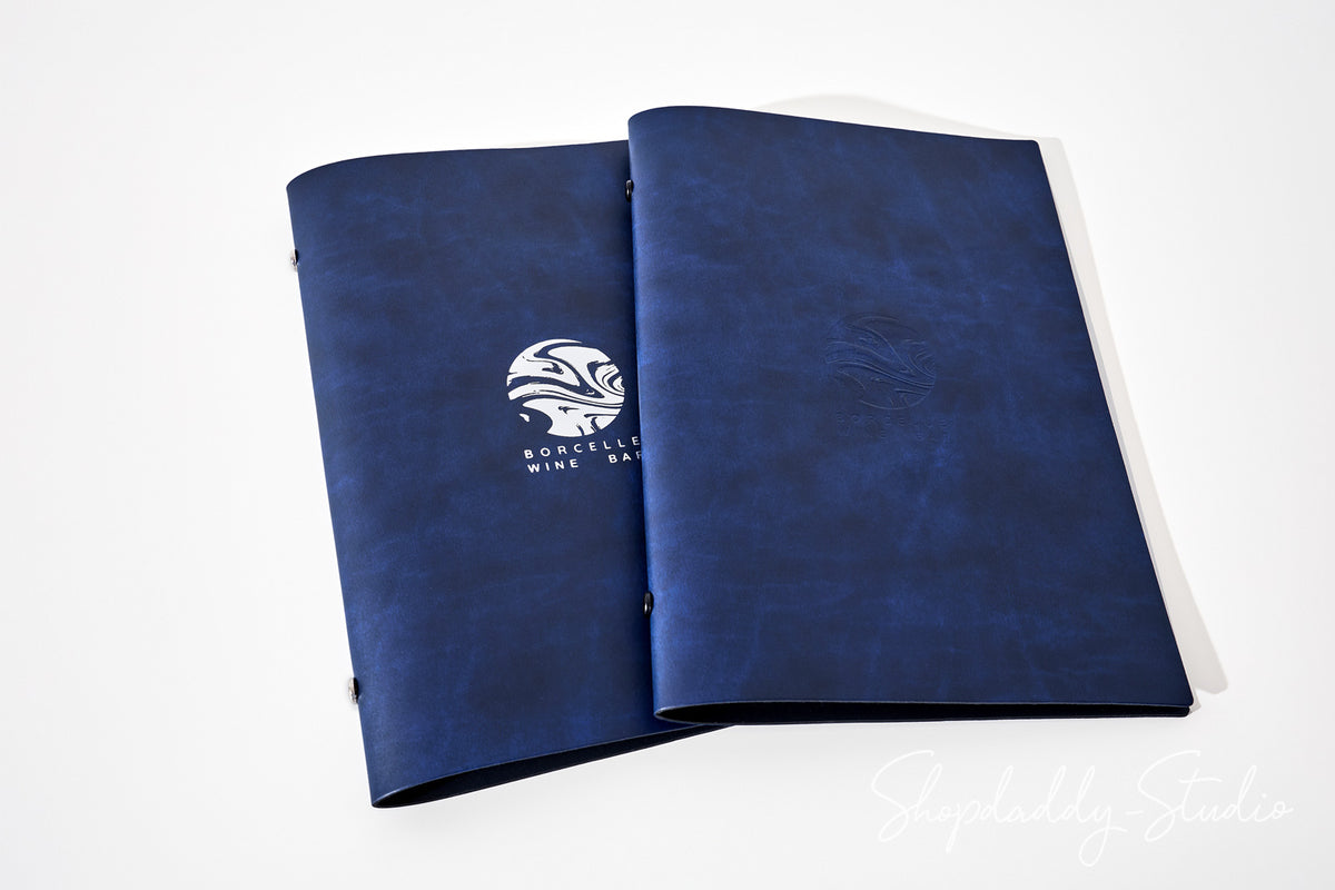 A navy blue binder or folder with a textured faux-leather finish, featuring a white printed logo and text on the left cover, displayed on a clean white background.