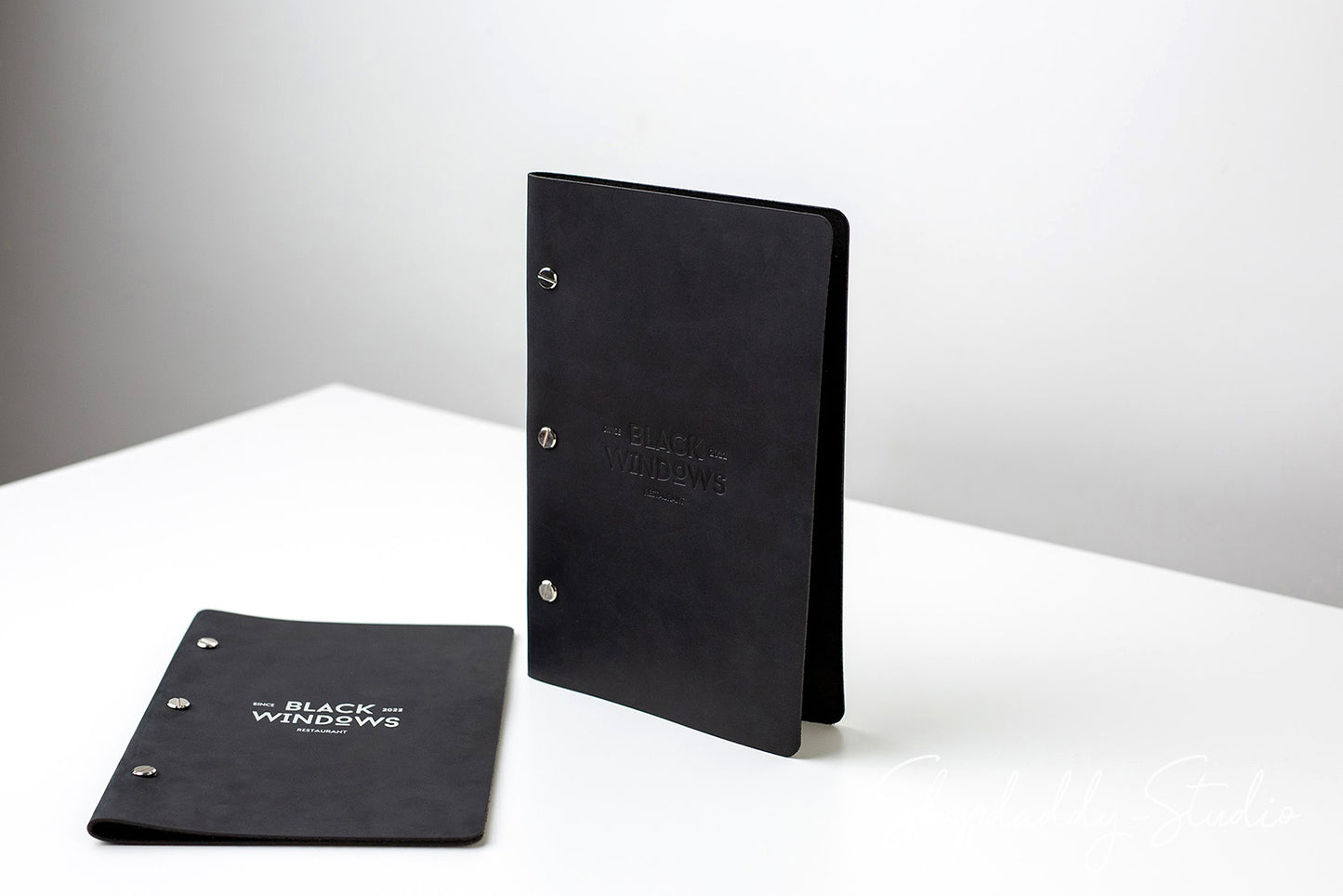 Custom Black Leather Menu Cover with Brass Bolts