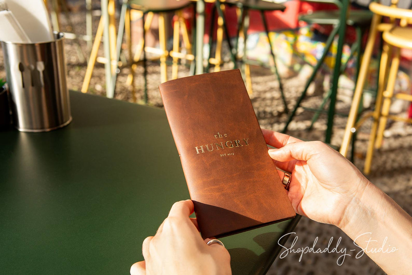 Durable recycled leather check holder with rustic antique brown finish and pen loop.