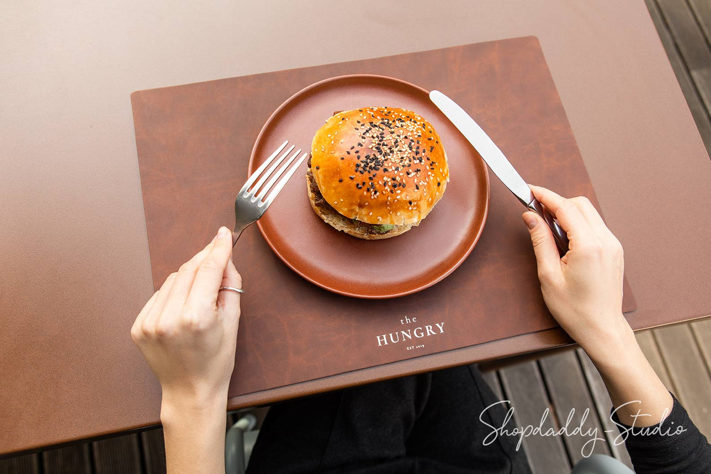 Eco-friendly antique brown leather placemat crafted from recycled materials.