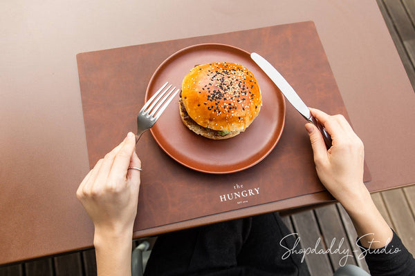 Eco-friendly antique brown leather placemat crafted from recycled materials.