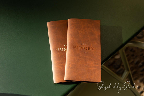 Eco-friendly check presenter in antique brown recycled leather, featuring a pen holder.