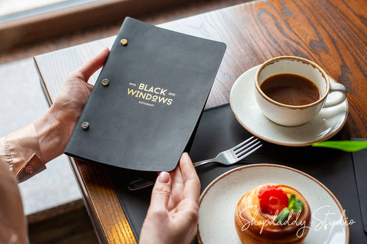 Elegant Black Leather Menu Cover with Brass Bolts