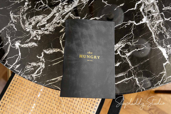 Close-up of bonded leather texture and metal binder rings