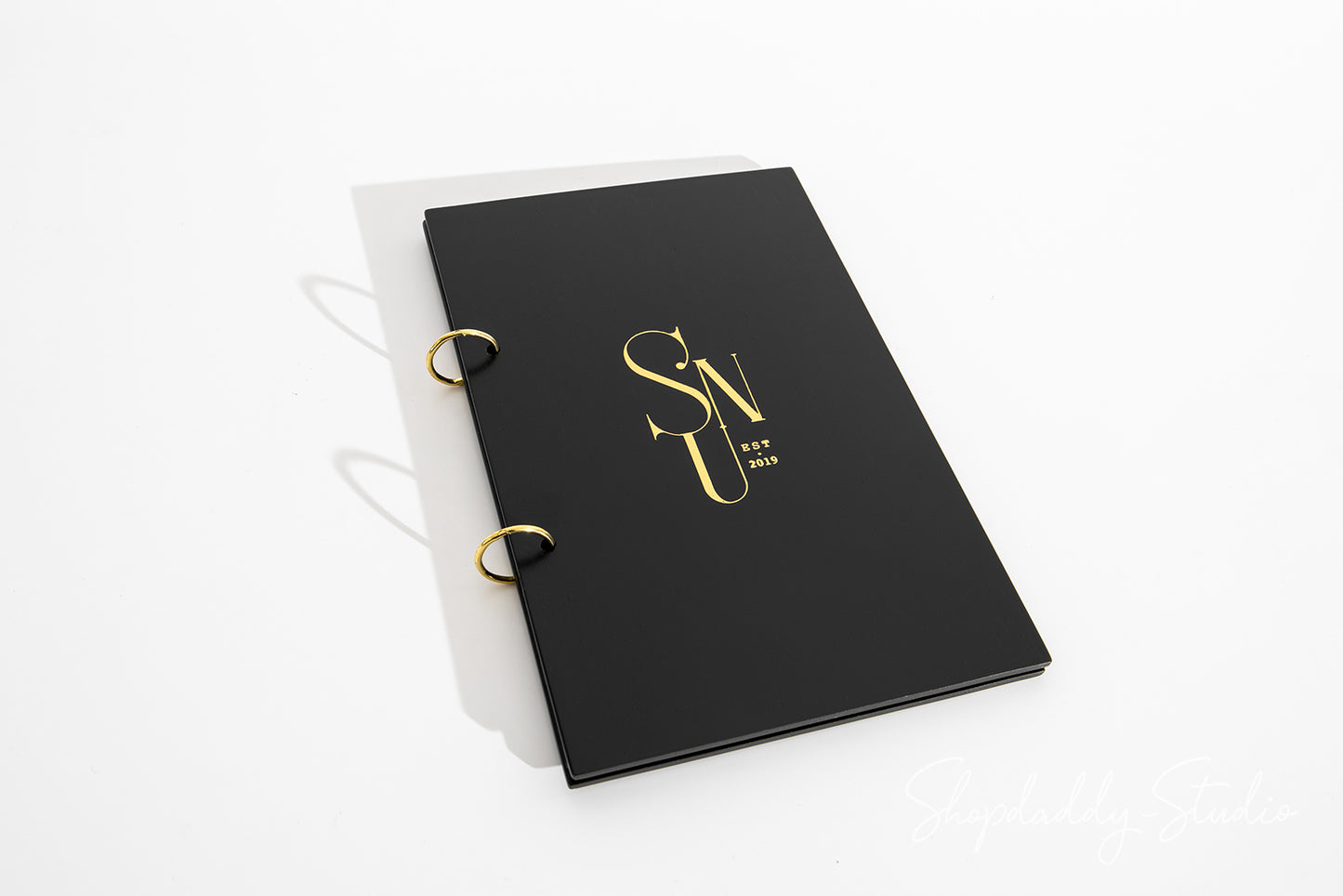 Minimalist Black Plywood Menu Book with Golden Rings
