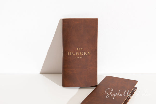 Minimalist antique brown check presenter crafted from sustainable recycled leather.