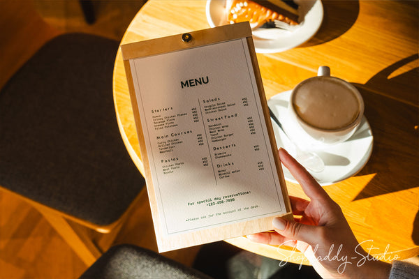 Plywood menu board with a natural wood texture and brass screw, blending simplicity and functionality.