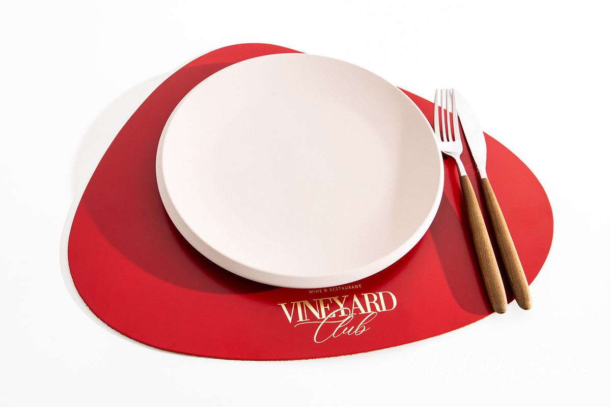 Red Thick Leather Pebble Table Dining Placemat with gold logo
