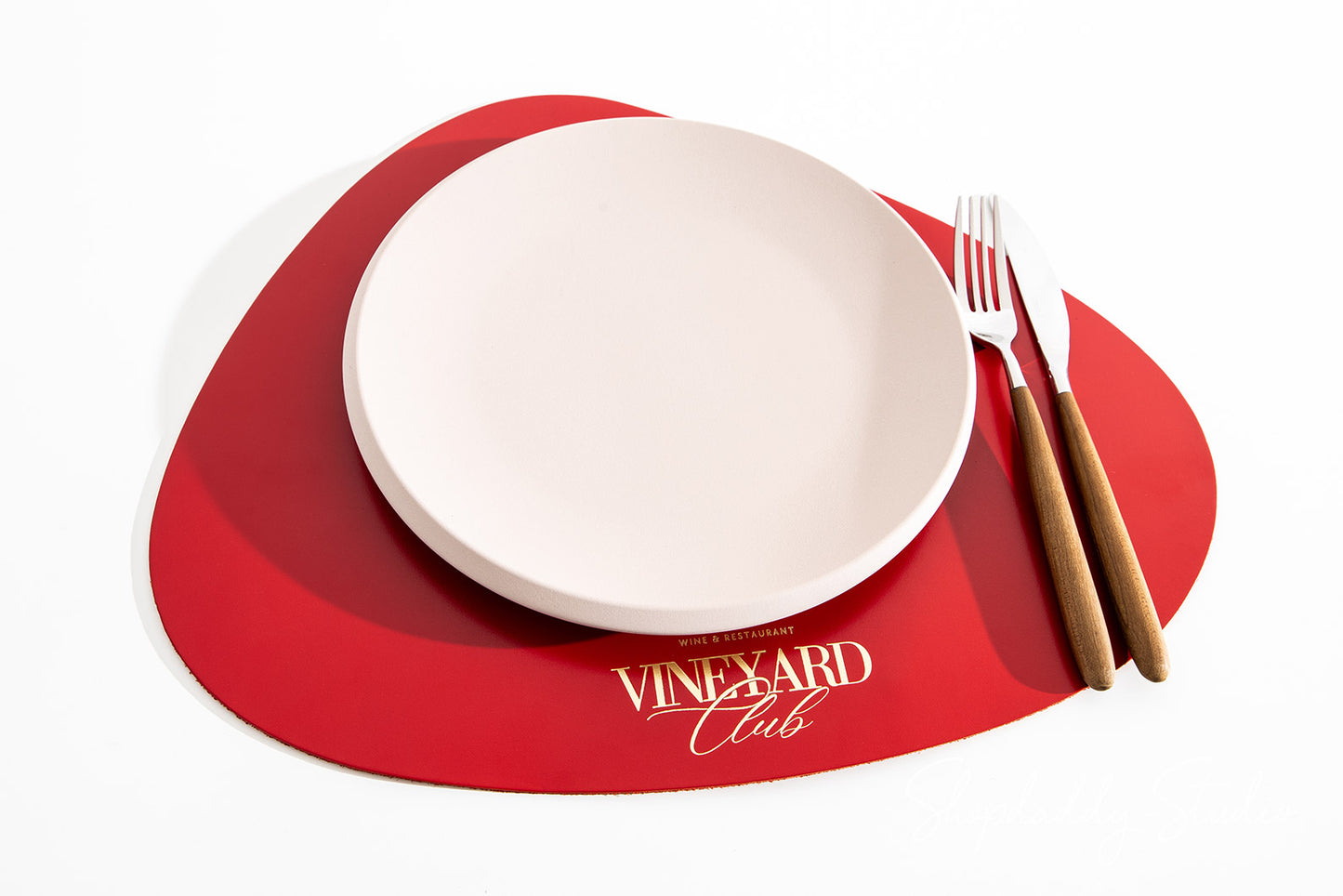 Red Thick Leather Pebble Table Dining Placemat with gold logo