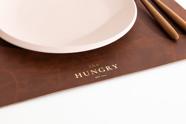 Rustic recycled leather placemat in antique brown, ideal for cafes and homes.