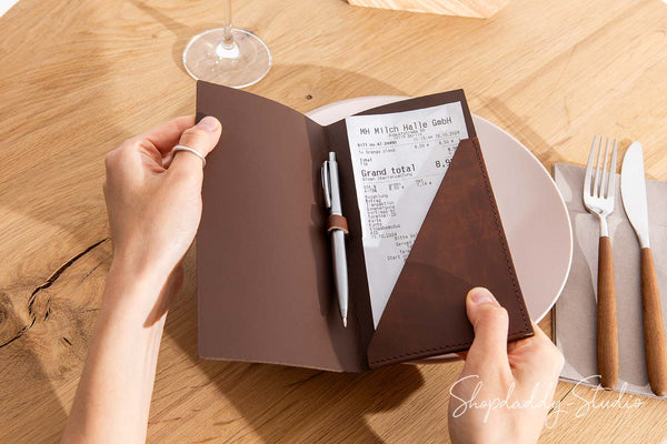 Stylish antique brown leather check presenter with pen loop for restaurants.