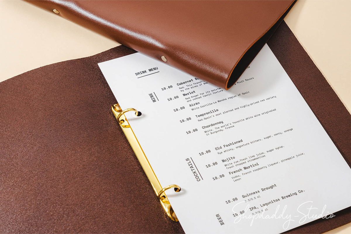 brown leather menu holder with ring mechanism for cafe