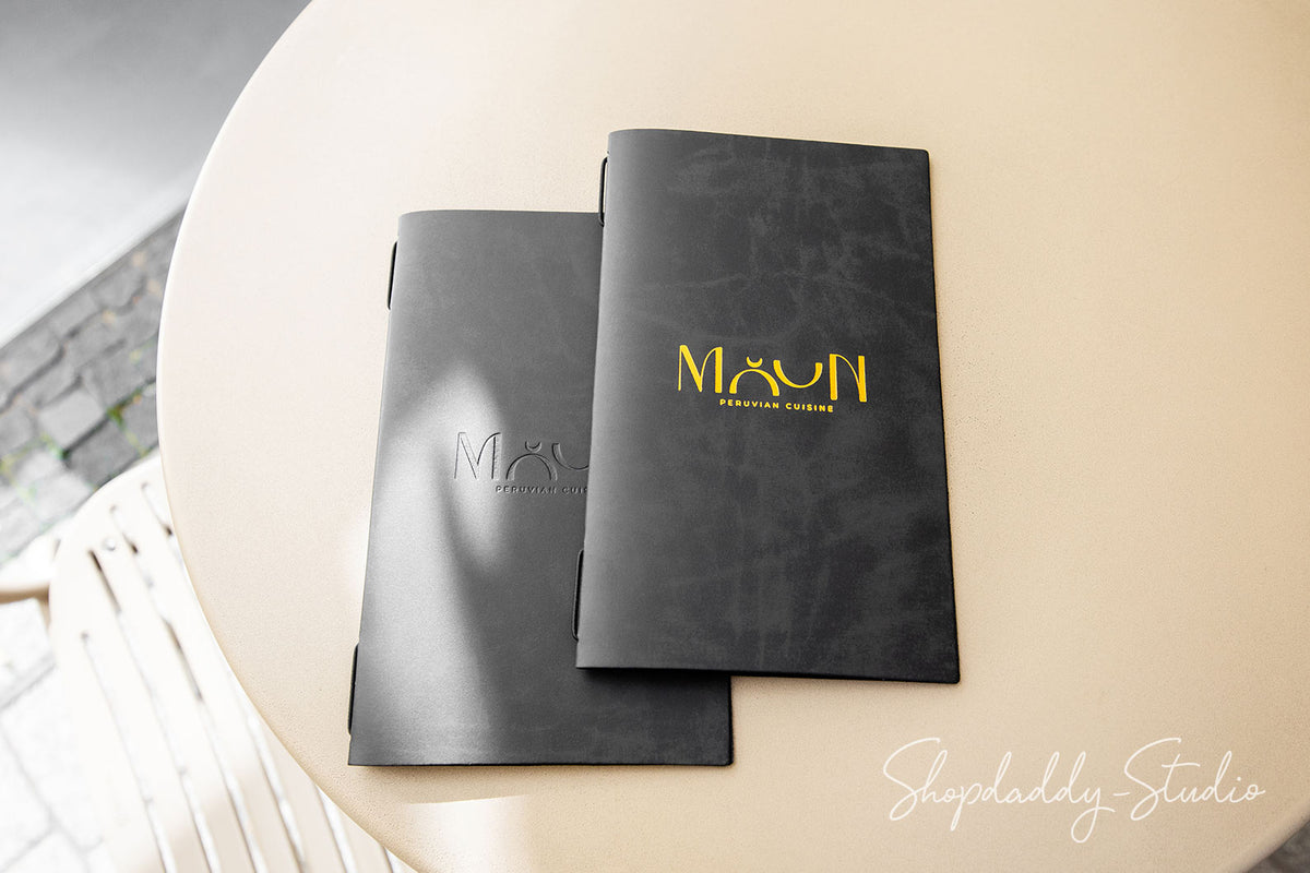 Minimalist leather menu cover on wooden restaurant table