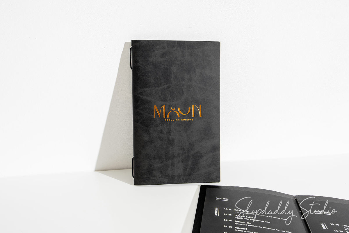 Close-up of leather texture and stitching on menu cover