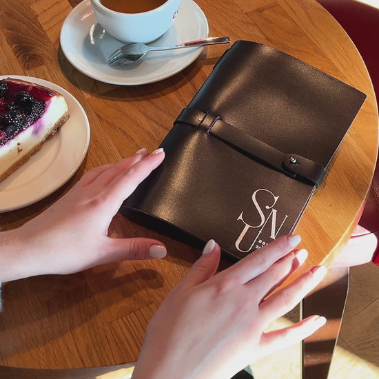 custom dark brown leather menu cover, showcasing its rich texture and durable stitching