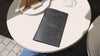 Recycled leather menu holders arranged for bulk order display