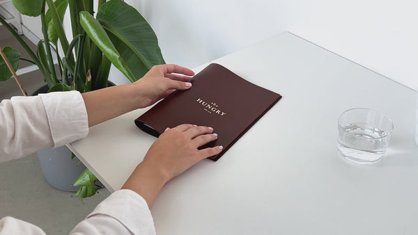 brown leather menu holder with ring mechanism