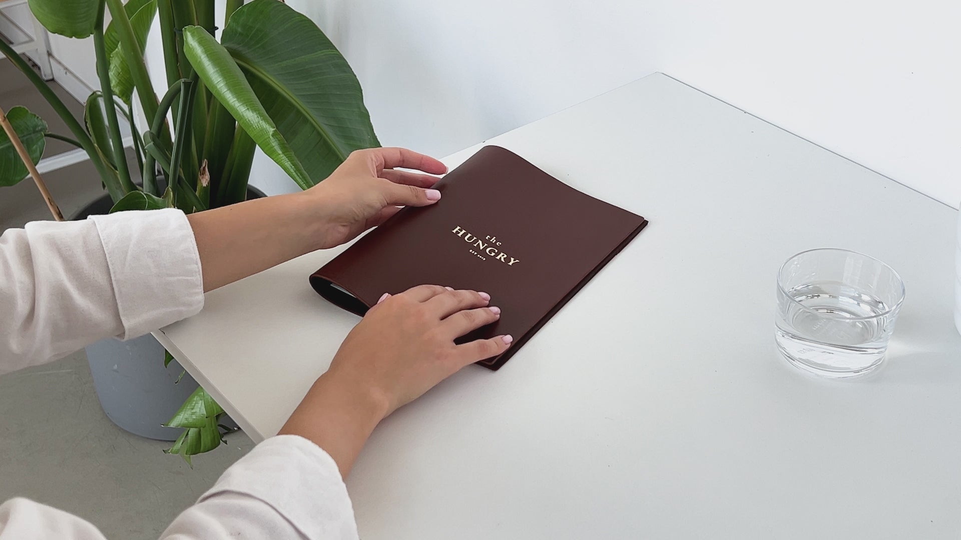 brown leather menu holder with ring mechanism