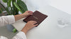 brown leather menu holder with ring mechanism