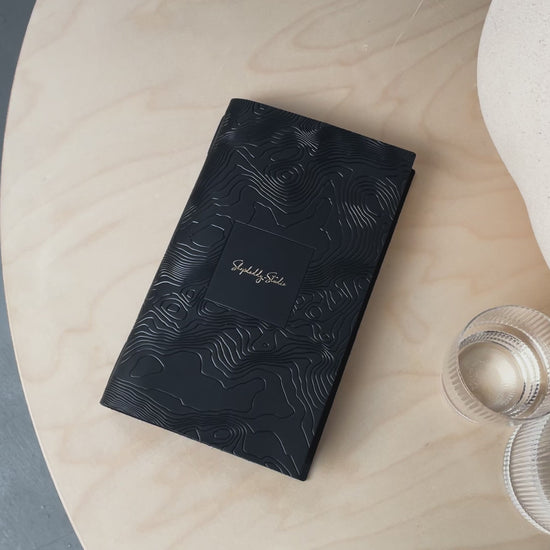 Black leather menu cover with pattern