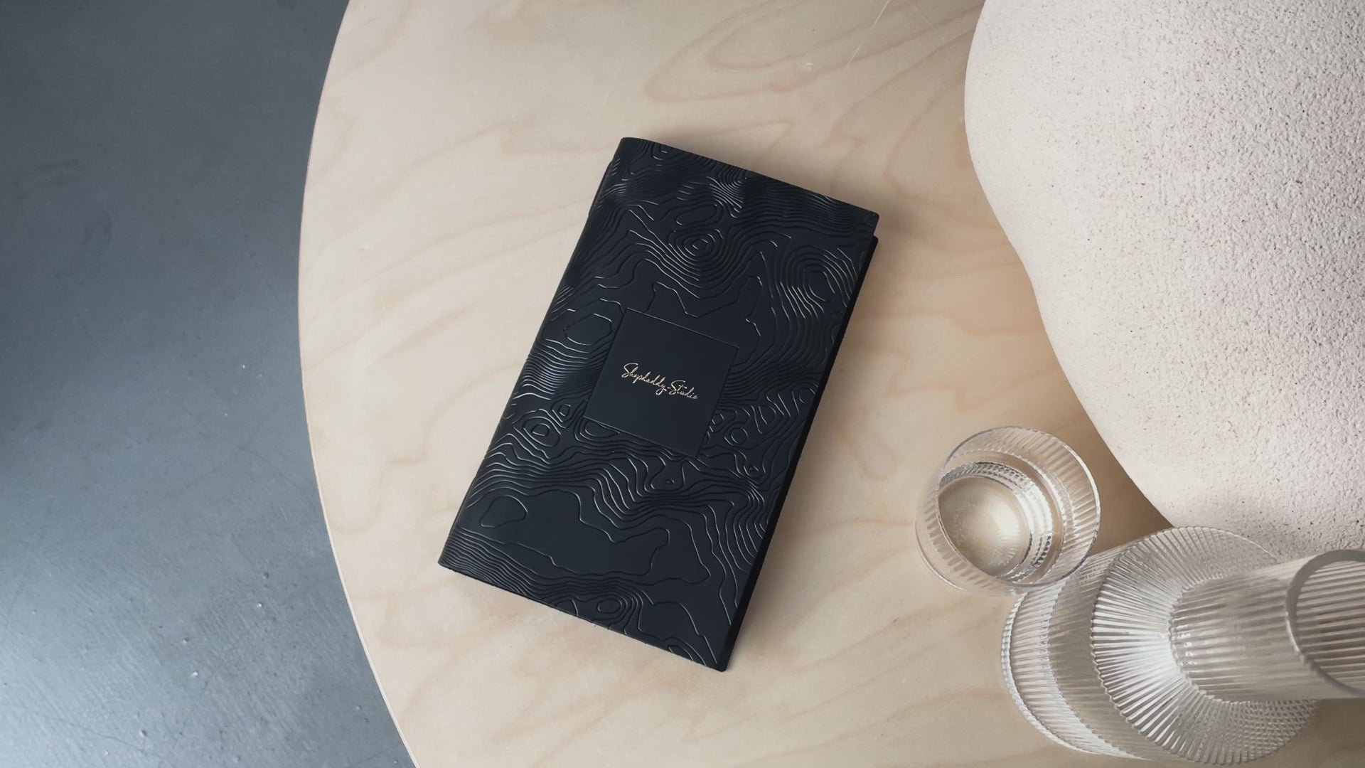 Black leather menu cover with pattern